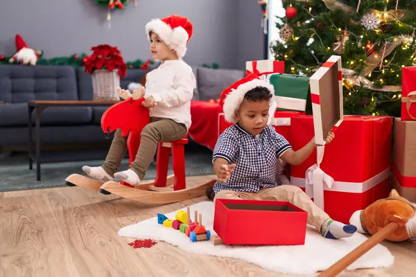 Adorable Boys Playing Reindeer Rocking Unpacking Christmas Gift Home — Stock Photo, Image