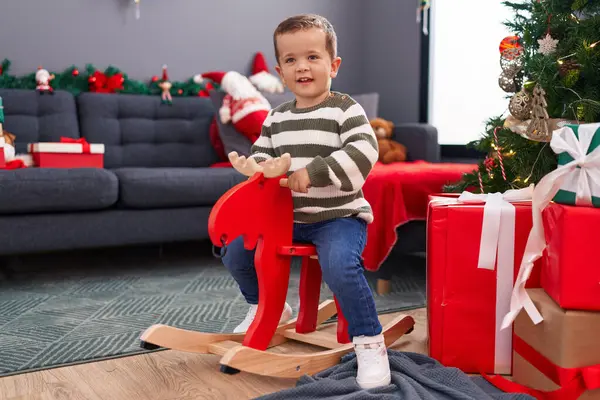 Adorable Caucasian Boy Playing Reindeer Rocking Christmas Tree Home — Stock Photo, Image