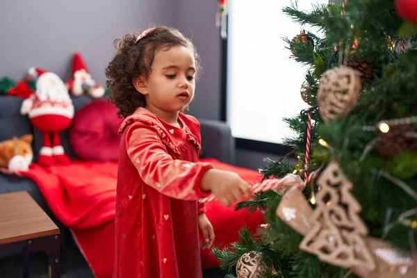 Adorable Hispanic Girl Decorating Christmas Tree Home — Stock Photo, Image