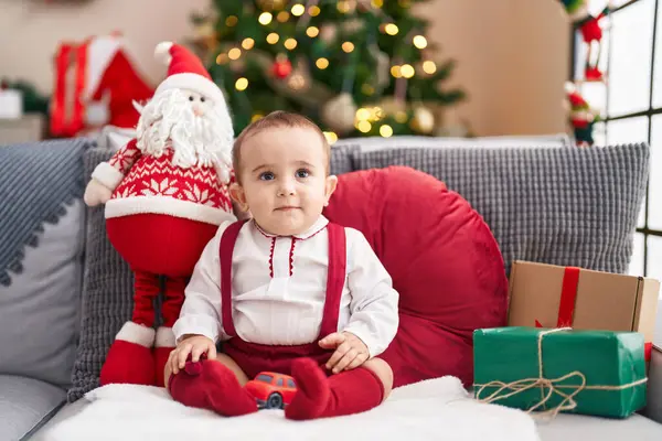Adorable Hispanic Baby Smiling Confident Sitting Sofa Christmas Tree Home — ストック写真