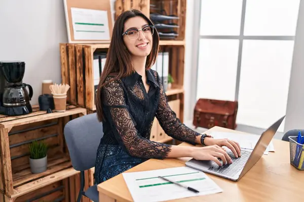 Young beautiful hispanic woman business worker using laptop working at office