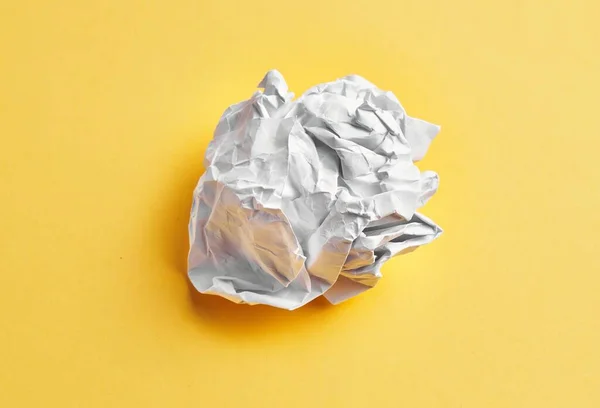 One White Crumpled Paper Ball Isolated Yellow Background — Fotografia de Stock