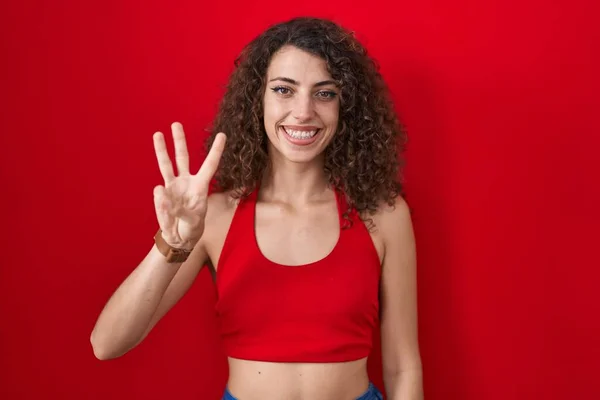 Hispanic Woman Curly Hair Standing Red Background Showing Pointing Fingers — Stock Photo, Image