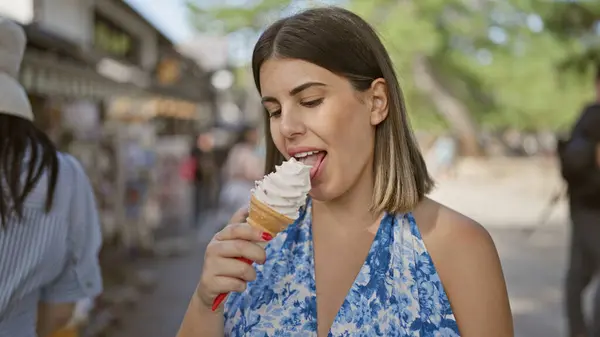 Summertime delight, beautiful hispanic woman enjoying delicious ice cream cone on a sunny day in nara, japan\'s luscious park, her cheerful smile reflecting holiday fun and outdoor adventures