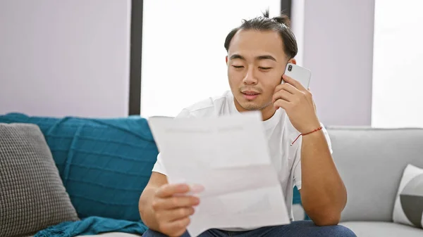 Rad Chinese Guy Casually Sitting His Living Room Sofa Seriously — Stock Photo, Image