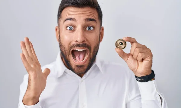 Handsome Hispanic Man Holding Polkadot Cryptocurrency Coin Celebrating Victory Happy — Stock Photo, Image