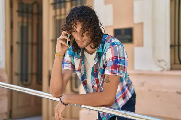 Young Hispanic Man Talking Smartphone Serious Expression Street — Stock Photo, Image