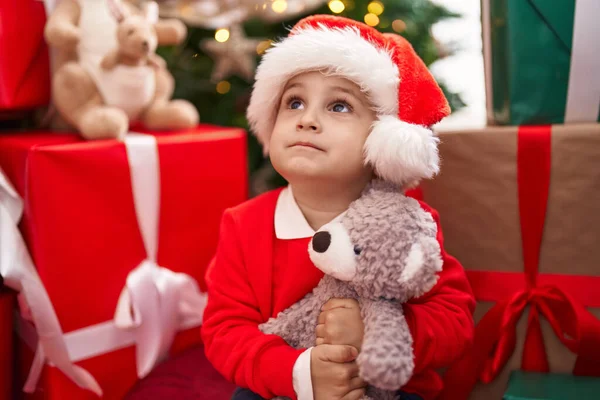Adorable Hispanic Toddler Hugging Teddy Bear Sitting Floor Christmas Gifts — Stock Photo, Image