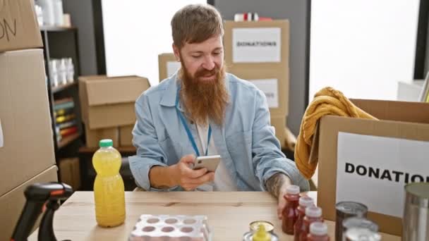 Smiling Redhead Man Taking Picture Canned Food Smartphone Charity Center — Stock Video