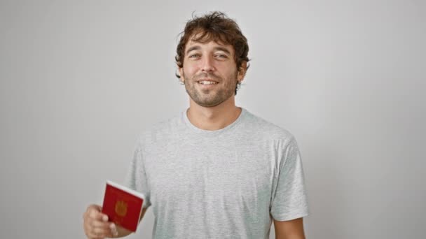 Radosny Młody Człowiek Uśmiechem Przekazuje Swój Duński Paszport Odizolowany Białym — Wideo stockowe