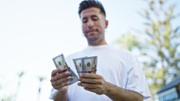Young Hispanic Man Counting Dollars Street — ストック動画