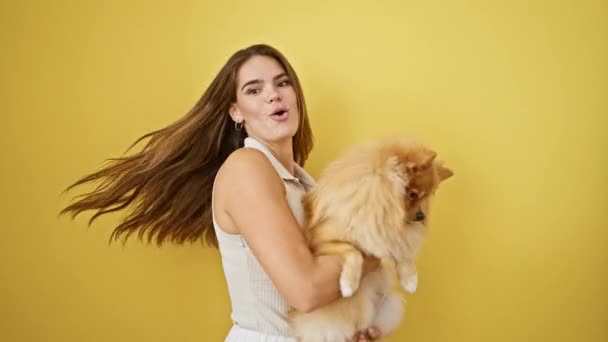 Radiant Young Hispanic Woman Hugging Her Playful Dog Confidently Standing — Stock Video