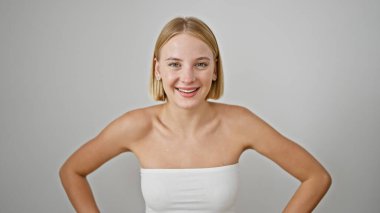 Young blonde woman smiling confident standing over isolated white background