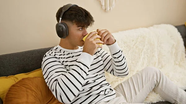 Attractive Young Hispanic Man Seriously Engrossed Listening Music Headphones Relaxed — Stock Photo, Image