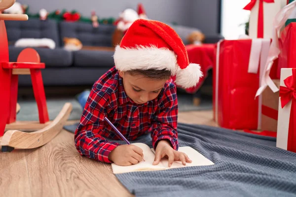 Adorable Hispanic Boy Writing Santa Claus Letter Sitting Christmas Tree — Stok fotoğraf