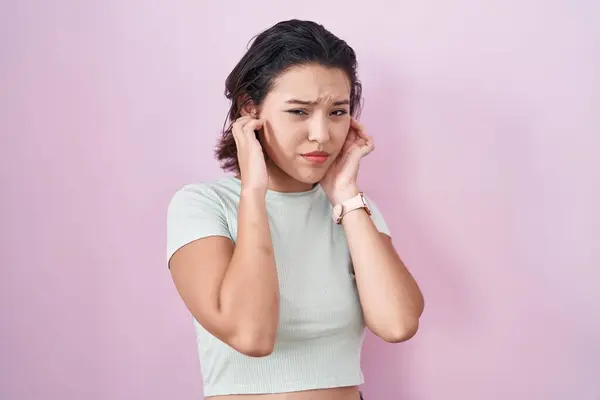 Hispanic Young Woman Standing Pink Background Covering Ears Fingers Annoyed — Stock Photo, Image