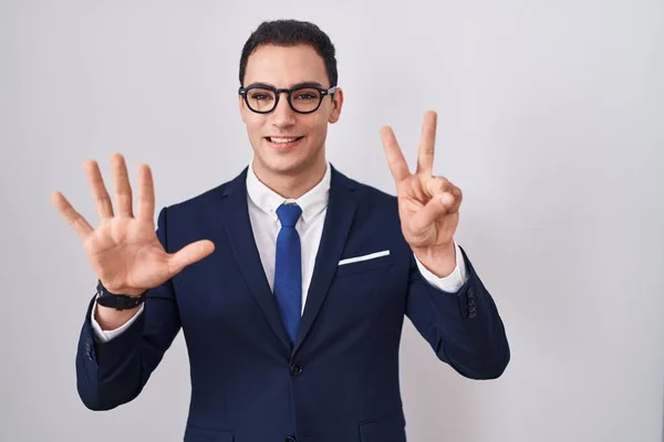 Young Hispanic Man Wearing Suit Tie Showing Pointing Fingers Number — Stock Photo, Image