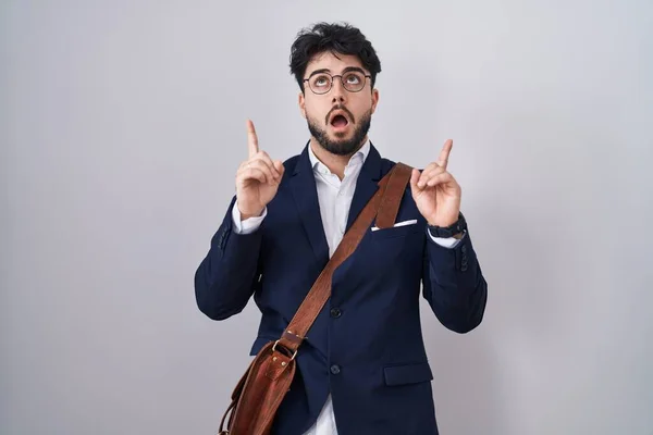 Hispanic Man Beard Wearing Business Clothes Amazed Surprised Looking Pointing — Stock Photo, Image