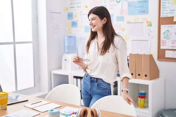 Young caucasian woman business worker smiling confident standing at office