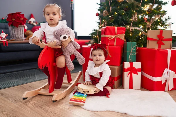 Adorable Girls Playing Reindeer Rocking Celebrating Christmas Home — Stock Photo, Image