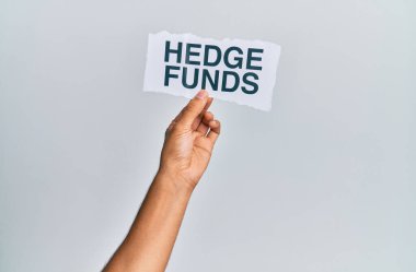 Hand of caucasian man holding paper with hedge funds message over isolated white background