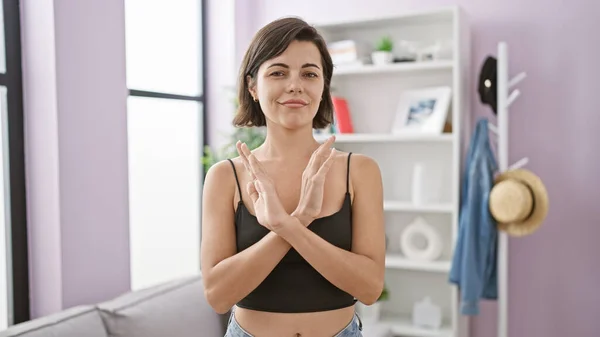 Stunning Young Hispanic Woman Adamantly Displays Stop Gesture Arms Home — Stock Photo, Image