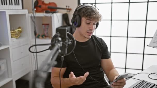 Attractive Young Hispanic Man Reporter Presenting Lively Radio Show Reading — Stock Video