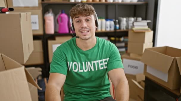 Kind Hearted Young Hispanic Man Volunteering Charity Center Sitting Table — Stock Video