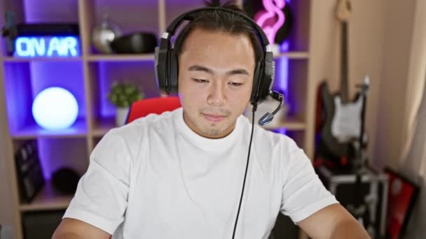 Confident Young Chinese Streamer Grinning Ear Ear Plays Riveting Video — Stock Video