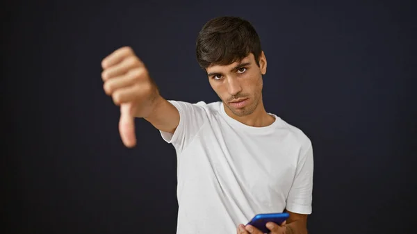 Cool Young Hispanic Man Casual Fashion Delivering Negative Thumb Gesture — Stock Photo, Image