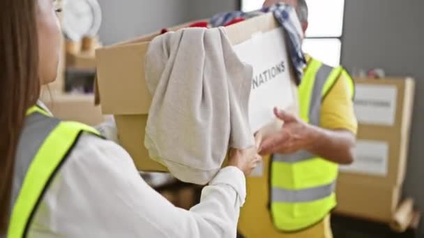 Cheerful Man Woman Volunteers Confidently Giving Cardboard Box Full Clothes — Stock Video