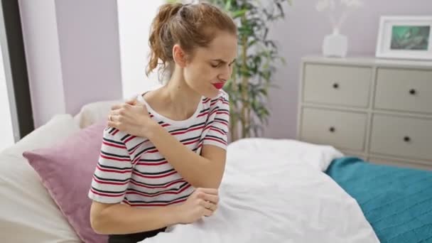 Woman Wincing Bedroom Showing Discomfort Illness Pain Muscle Health Issues — Stock Video