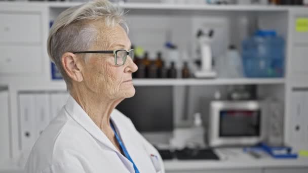 Confident Smiling Grey Haired Senior Woman Scientist Enjoying Her Work — Stock Video