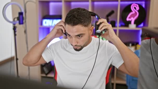 Young Man Beard Wearing Headphones Sits Desk Microphone Modern Gaming — Stock Video