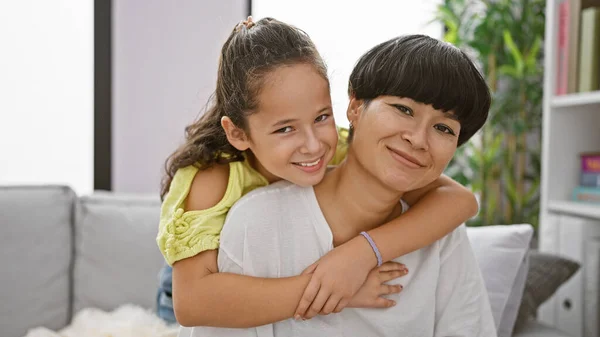 Confident Mother Daughter Sharing Joyful Hug Smiling Heartily While Sitting — Stock Photo, Image
