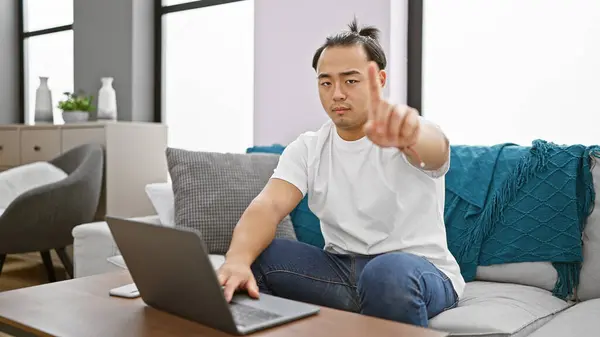 Stressed Out Young Chinese Man Concentrated Laptop Saying Finger Home — Stock Photo, Image