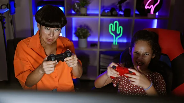 Mother-daughter gaming duo streaming love, fun-filled night of video gaming in their cozy room