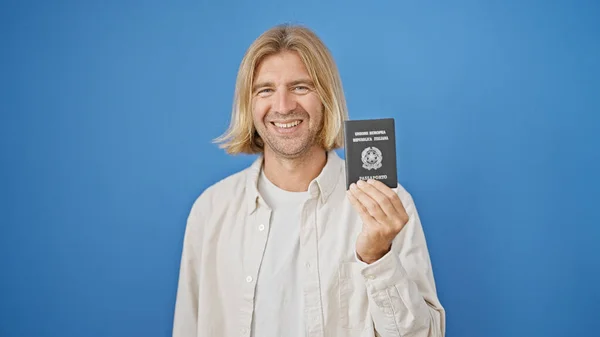 Smiling Blond Man Holding Italian Passport Blue Background Portraying Travel — Stock Photo, Image