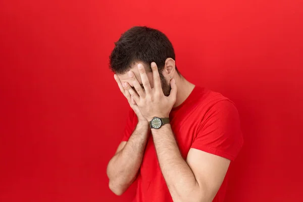 Young Hispanic Man Wearing Casual Red Shirt Sad Expression Covering —  Fotos de Stock