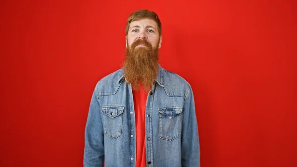 Young Redhead Man Standing Serious Expression Isolated Red Background — Stock Photo, Image