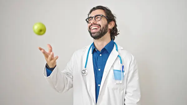Young Hispanic Man Doctor Smiling Confident Holding Apple Isolated White — Stock Photo, Image