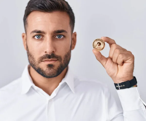 Handsome Hispanic Man Holding Polkadot Cryptocurrency Coin Thinking Attitude Sober — Stock Photo, Image