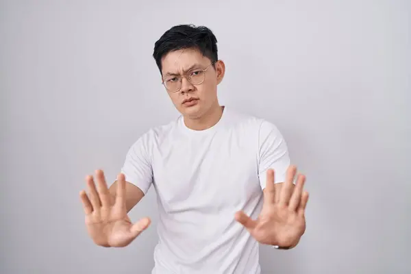 Young Asian Man Standing White Background Moving Away Hands Palms — Stock Photo, Image