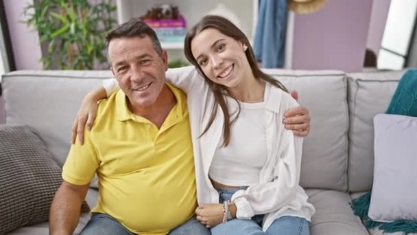 Joyful Family Time Father Daughter Sharing Heartwarming Hug Sitting Sofa — Stock Video