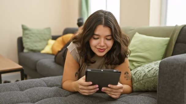 Cheerful Young Hispanic Woman Engages Tablet Her Cozy Living Room — Stock Video