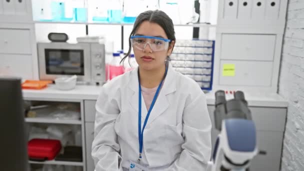 Young Beautiful Hispanic Woman Scientist Shows Skeptic Face Nervous Disapproving — Stock Video