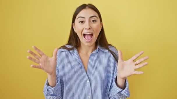 Triumphant Young Hispanic Woman Standing Yellow Isolated Background Displaying Her — Stock Video