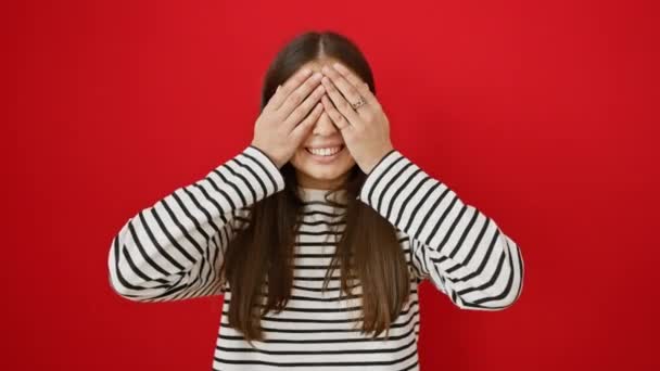 Young Beautiful Hispanic Woman Wearing Stripes Shirt Standing Peeking Shock — Stock Video