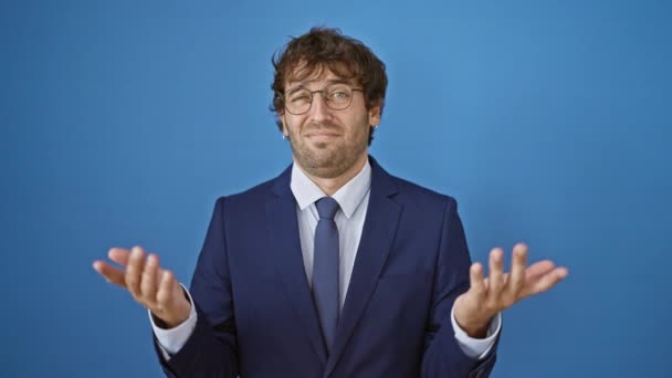 Young Clueless Man Business Suit Undecided Arms Wide Isolated Blue — Stock Video
