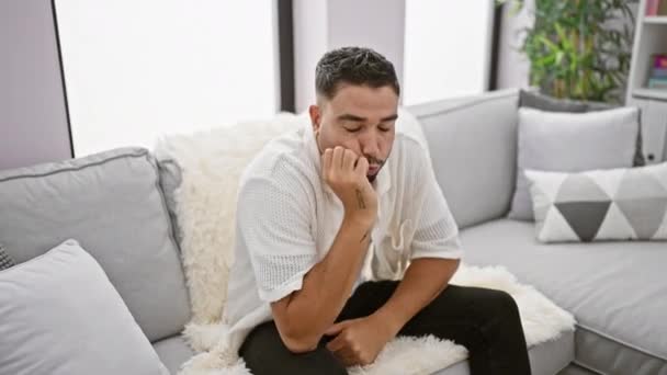 Anxious Arab Man Biting Nails Sofa Stress Expression Home Pressure — Stock Video
